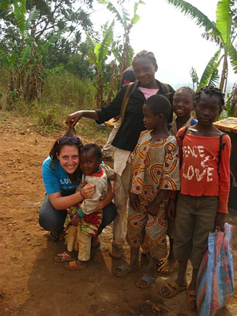 UD anthropology student with students in Africa